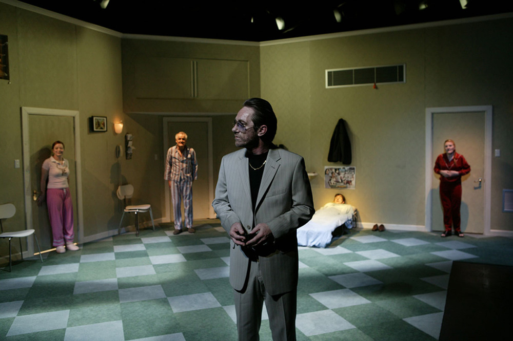 Production still for "The Metamorphosis". L-R: Mandy McElhinney, Tony Llewellyn-Jones, Kim Gyngell, Matthew Whittet (in bed), Julie Forsyth. Photographer: Jeff Busby