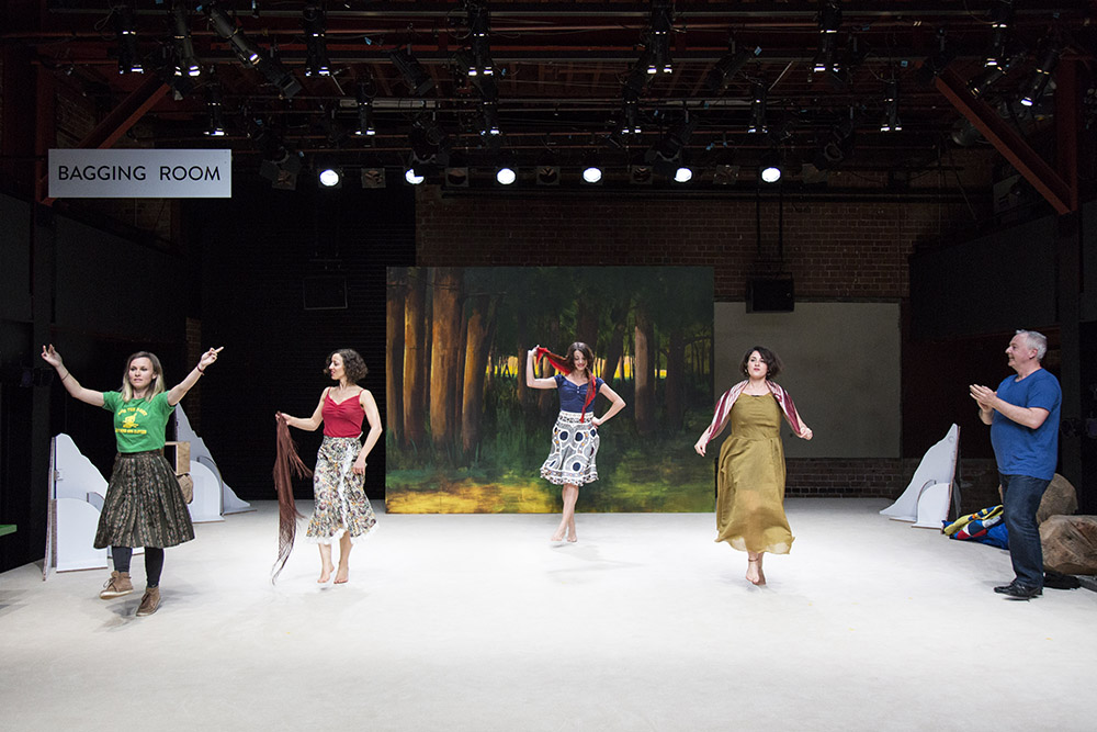Production still for "Come Away with Me to the End of the World". Beth Buchanan (far left) and Patrick Moffatt (far right) with Rosa Voto and dancers. Photographer: Pia Johnson