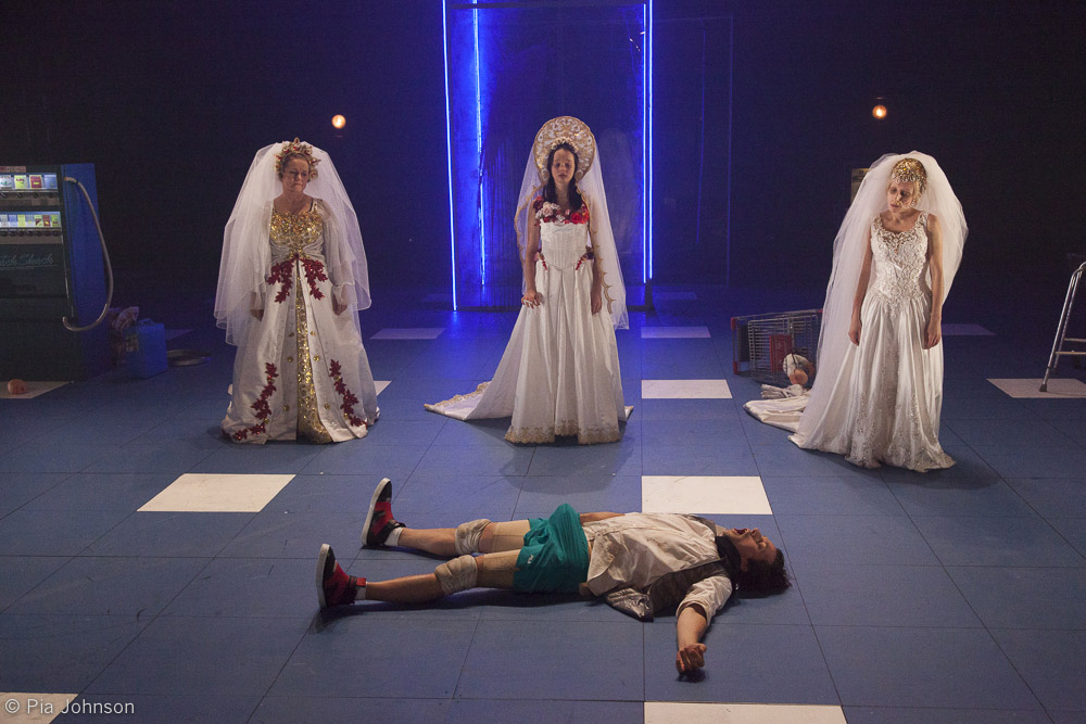 Production still for "The Good Person of Szechuan". L-R: Genevieve Morris, Emily Milledge, Richard Pyros (lying), Genevieve Giuffre. Photographer: Pia Johnson