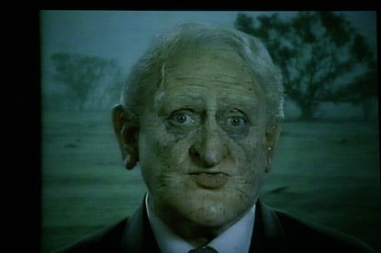 Production still for "The Big Con". Max Gillies as Philip Ruddock. Photographer: Lisa Tomasetti