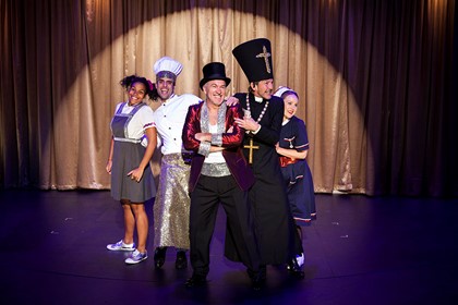 Production still for "The Government Inspector". L-R: Zahra Newman, Fayssal Bazzi, Greg Stone, Robert Menzies, Eryn-Jean Norvill. Photographer: Pia Johnson