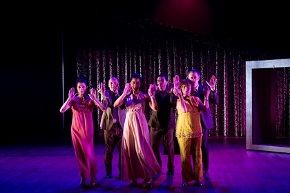 Production still for "Away". L-R: Heather Mitchell, Glenn Hazeldine, Naomi Rukavina, Wadih Dona, Julia Davis, Marco Chiappi. Photographer: Pia Johnson