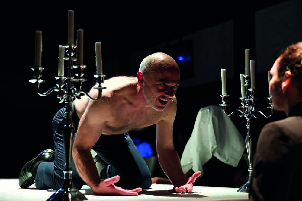 Production still for "Trustees". L-R: Daniel Schlusser, Tammy Anderson. Photographer: Nicolai Khalezin